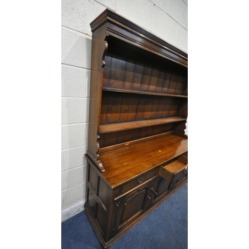 1266 - IN THE MANNER OF TITCHMARSH AND GOODWIN, A 20TH CENTURY SOLID OAK DRESSER, the three tier plate rack... 