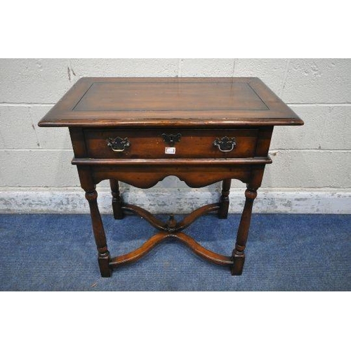 1271 - THEODORE ALEXANDER, A REPRODUCTION MAHOGANY SIDE TABLE / LOWBOY, with a single drawer, wavy apron, t... 