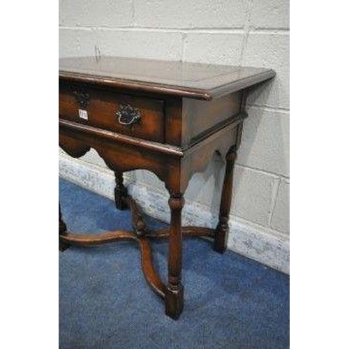 1271 - THEODORE ALEXANDER, A REPRODUCTION MAHOGANY SIDE TABLE / LOWBOY, with a single drawer, wavy apron, t... 