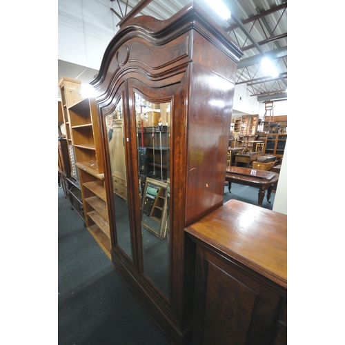 1297 - A 19TH CENTURY FRENCH FLAME MAHOGANY TWO DOOR WARDROBE, with bevelled edge mirror doors, enclosing a... 