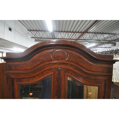 1297 - A 19TH CENTURY FRENCH FLAME MAHOGANY TWO DOOR WARDROBE, with bevelled edge mirror doors, enclosing a... 