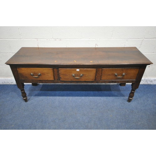 1303 - A GEORGIAN AND LATER OAK DRESSER BASE, fitted with three drawers, raised on turned front legs, lengt... 