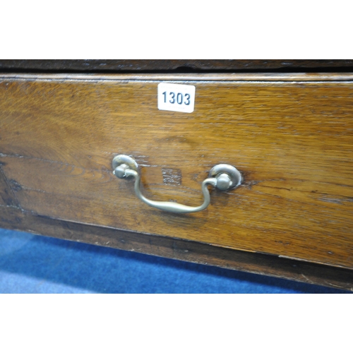 1303 - A GEORGIAN AND LATER OAK DRESSER BASE, fitted with three drawers, raised on turned front legs, lengt... 