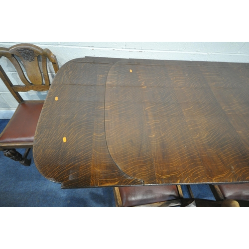 1306 - A 20TH CENTURY OAK SIX PIECE LOUNGE SUITE, comprising a draw leaf dining table, with a carved apron,... 