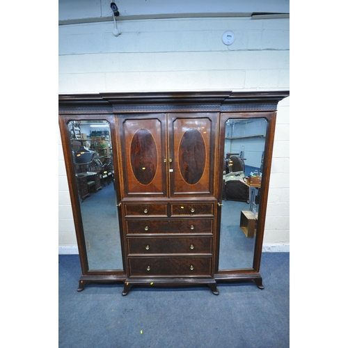 1322 - WARING OF OXFORD STREET LONDON, an early 20th century mahogany compactum wardrobe, with two bevelled... 