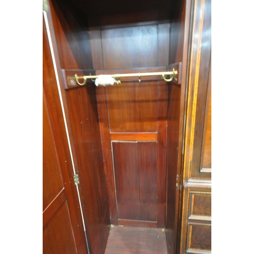 1322 - WARING OF OXFORD STREET LONDON, an early 20th century mahogany compactum wardrobe, with two bevelled... 