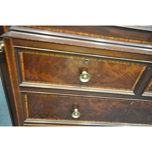 1322 - WARING OF OXFORD STREET LONDON, an early 20th century mahogany compactum wardrobe, with two bevelled... 