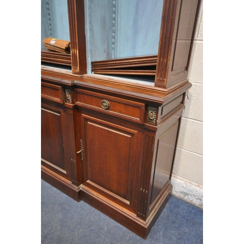 1325 - A REPRODUCTION MAHOGANY BREAKFRONT BOOKCASE, the open triple section top with a blue painted interio... 