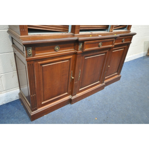 1325 - A REPRODUCTION MAHOGANY BREAKFRONT BOOKCASE, the open triple section top with a blue painted interio... 