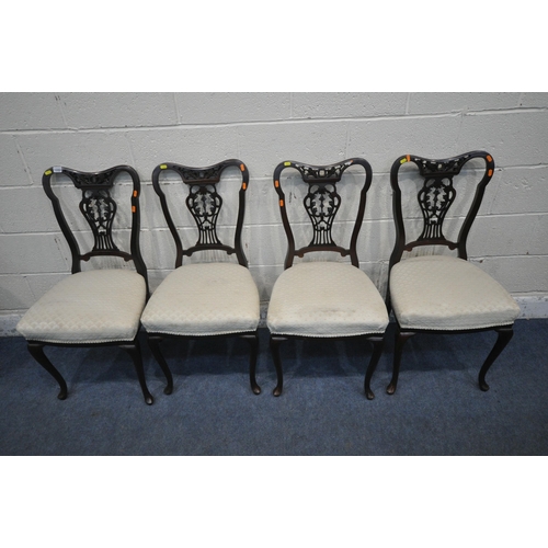 1333 - A SET OF FOUR MAHOGANY DINING CHAIRS, with foliate splat backs, raised on front cabriole legs (condi... 