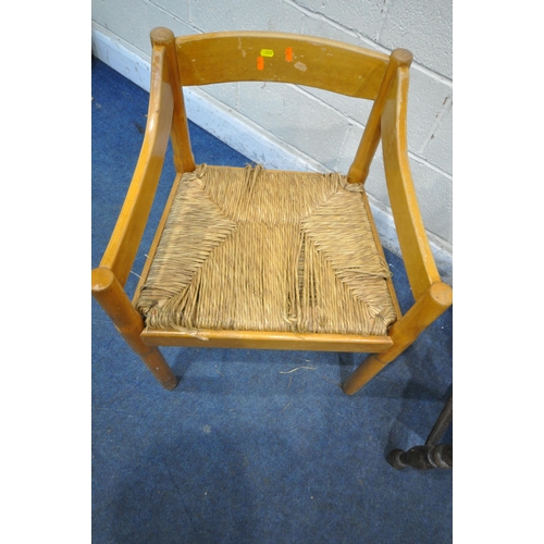 1335 - A 20TH CENTURY OAK ARMCHAIR, with swept armrests, raised on turned legs, united by stretchers, along... 