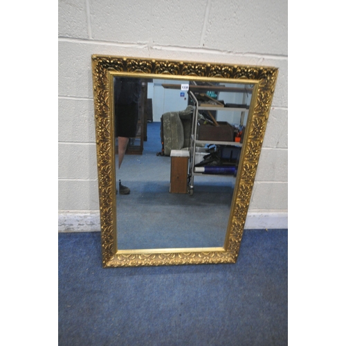 1338 - A GILT FRAMED RECTANGULAR BEVELLED EDGE WALL MIRROR, 105cm x 75cm (condition report: small chips to ... 