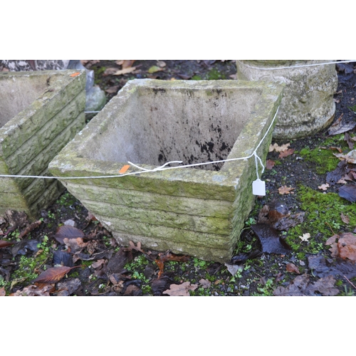 1022 - THREE WEATHERED COMPOSITE PLANTERS, two are 39cm square the other is 69cm wide and 39cm deep, all ha... 