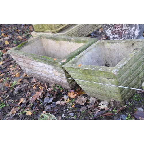 1022 - THREE WEATHERED COMPOSITE PLANTERS, two are 39cm square the other is 69cm wide and 39cm deep, all ha... 