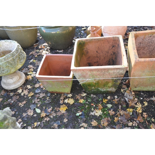 1027 - A COLLECTION OF TERRACOTTA COLOURED LARGE PLANT POTS including three square tapering baluster pots o... 