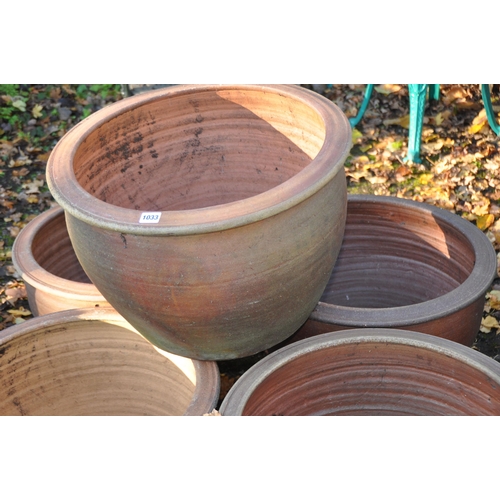 1033 - A SET OF FIVE LARGE BROWN GLAZED GARDEN POTS, with baluster sides diameter 55cm