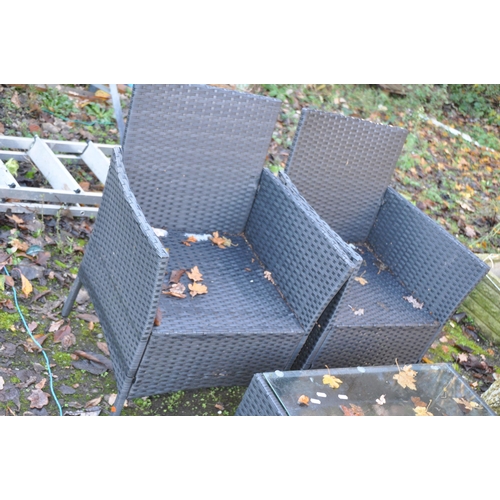 1040 - A MODERN RATTAN EFFECT GARDEN PATIO SET, consisting of a two seat sofa, width 100cm, two chairs and ... 