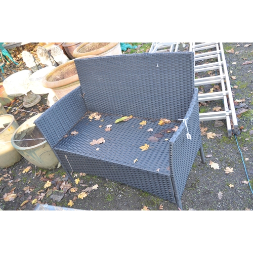 1040 - A MODERN RATTAN EFFECT GARDEN PATIO SET, consisting of a two seat sofa, width 100cm, two chairs and ... 