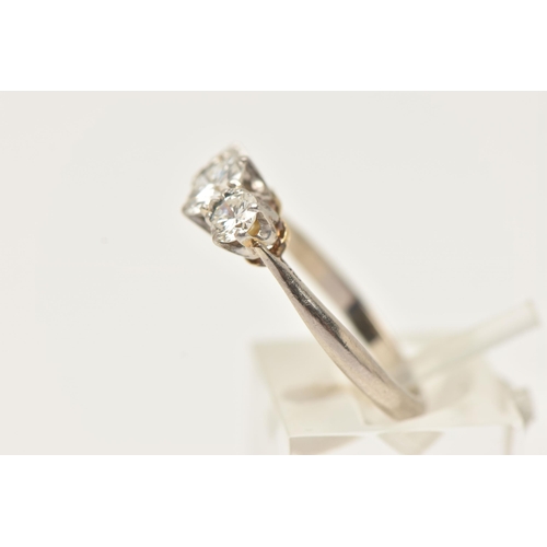 1 - A WHITE AND YELLOW METAL DIAMOND THREE STONE RING, set with graduating round brilliant cut diamonds,... 