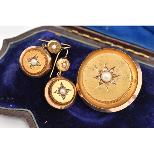 10 - A CASED YELLOW METAL DIAMOND BROOCH AND EARRING SUITE, the brooch of a polished circular form star s... 