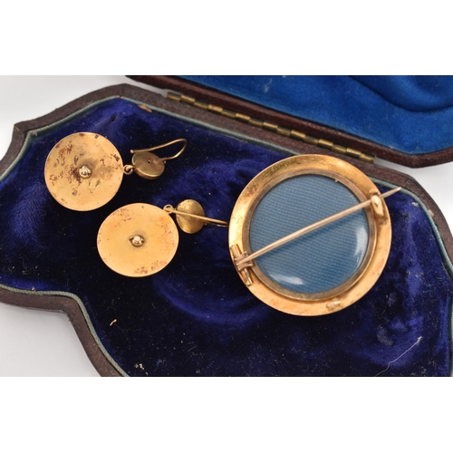 10 - A CASED YELLOW METAL DIAMOND BROOCH AND EARRING SUITE, the brooch of a polished circular form star s... 