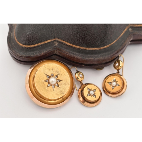 10 - A CASED YELLOW METAL DIAMOND BROOCH AND EARRING SUITE, the brooch of a polished circular form star s... 