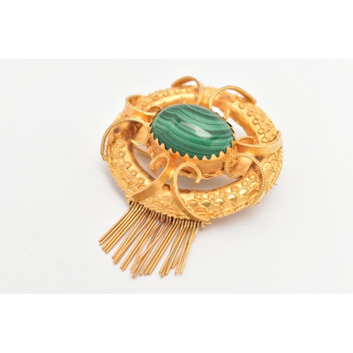 11 - A YELLOW METAL VICOTRIAN MALACHITE SET BROOCH, of an open work form, set to the centre with a malach... 