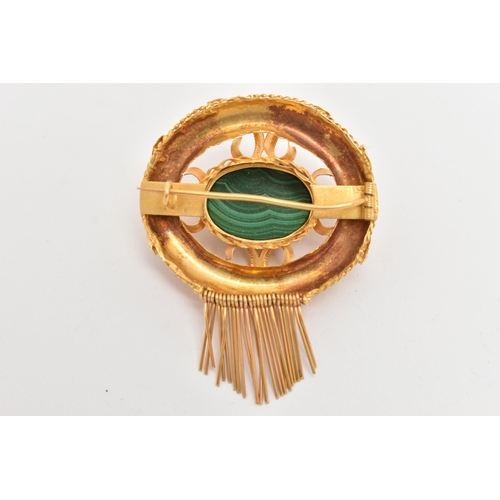 11 - A YELLOW METAL VICOTRIAN MALACHITE SET BROOCH, of an open work form, set to the centre with a malach... 