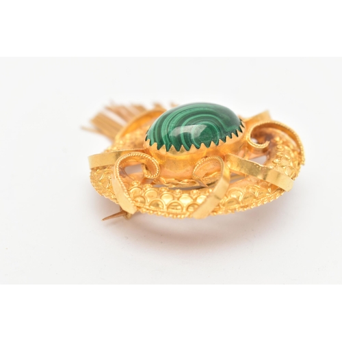 11 - A YELLOW METAL VICOTRIAN MALACHITE SET BROOCH, of an open work form, set to the centre with a malach... 