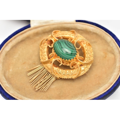 11 - A YELLOW METAL VICOTRIAN MALACHITE SET BROOCH, of an open work form, set to the centre with a malach... 