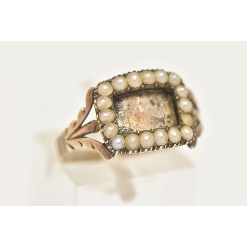 17 - A YELLOW METAL SPLIT PEARL MOURNING RING, of a rectangular form with vacant compartment missing glas... 