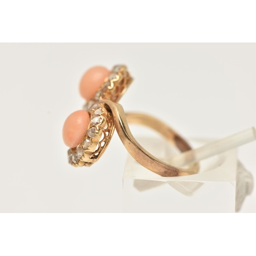 19 - A YELLOW METAL CORAL AND DIAMOND RING, of a cross over design, with two circular clusters each with ... 