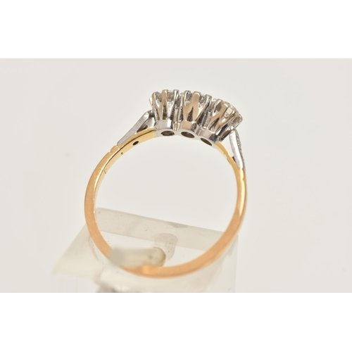 2 - A WHITE AND YELLOW METAL DIAMOND THREE STONE RING, set with slightly graduating round brilliant cut ... 