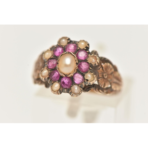 29 - A YELLOW METAL RUBY AND SPLIT PEARL CLUSTER RING, of an oval form set with a central split pearl wit... 