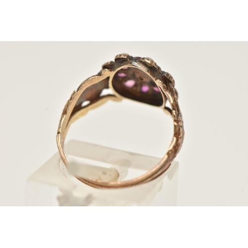 29 - A YELLOW METAL RUBY AND SPLIT PEARL CLUSTER RING, of an oval form set with a central split pearl wit... 