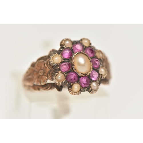 29 - A YELLOW METAL RUBY AND SPLIT PEARL CLUSTER RING, of an oval form set with a central split pearl wit... 