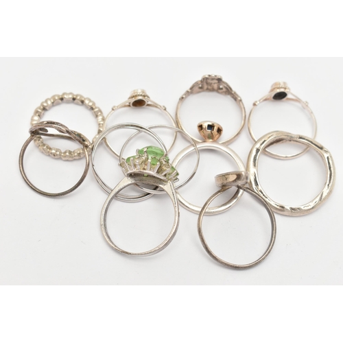 36 - AN ASSORTMENT OF TEN RINGS, to include seven white metal rings, approximate gross weight 15 grams, t... 