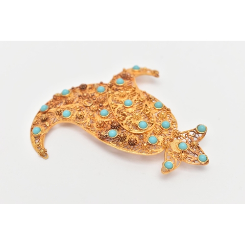 8 - A YELLOW METAL FILIGREE BROOCH, of Middle Eastern design, set with blue paste cabochon accents to th... 