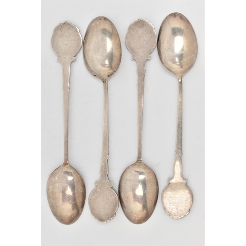 106 - FOUR SILVER TEASPOONS, each with a painted round terminal depicting dogs, the  scrolling stems and p... 