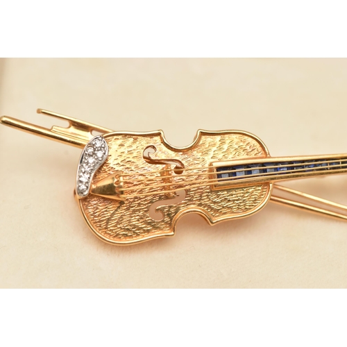 50 - AN 18CT GOLD VIOLIN BROOCH PENDANT, a yellow gold novelty brooch designed as a violin with a bow, wi... 