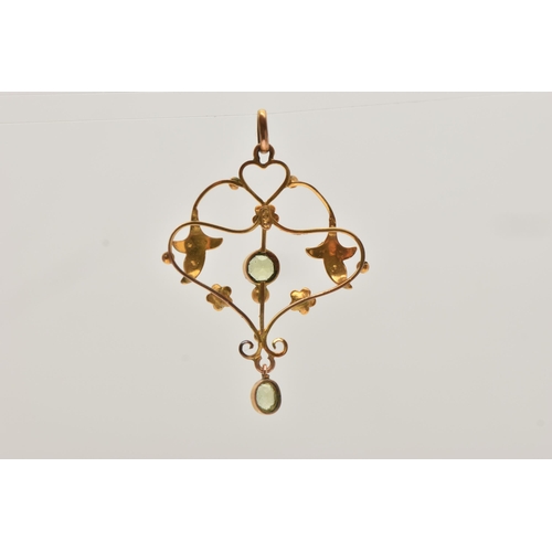 51 - AN EARLY 20TH CENTURY LAVALIER PENDANT, an open work scrolling pendant with foliage detail, set with... 