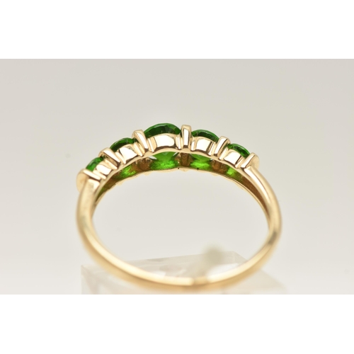 58 - A 9CT GOLD GEM SET RING, set with a row of five graduated circular cut chrome diopside, tension set ... 