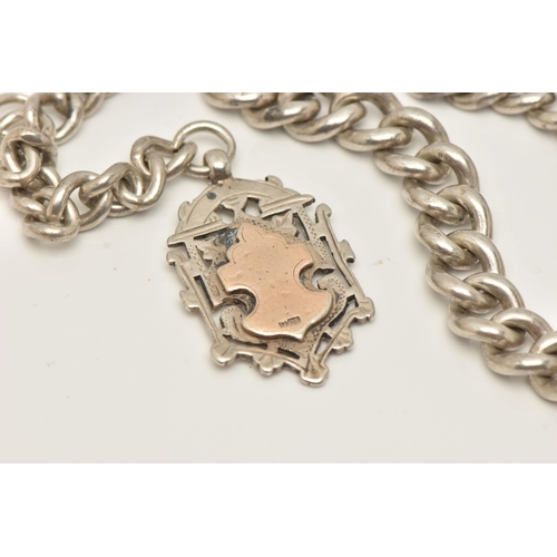 59 - A SILVER GRADUATED ALBERT CHAIN WITH FOB MEDAL, heavy graduated curb link Albert chain, each link st... 