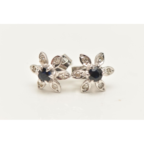 64 - A PAIR OF 18CT WHITE GOLD SAPPHIRE AND DIAMOND CLUSTER STUD EARRINGS, each of flower design with a c... 