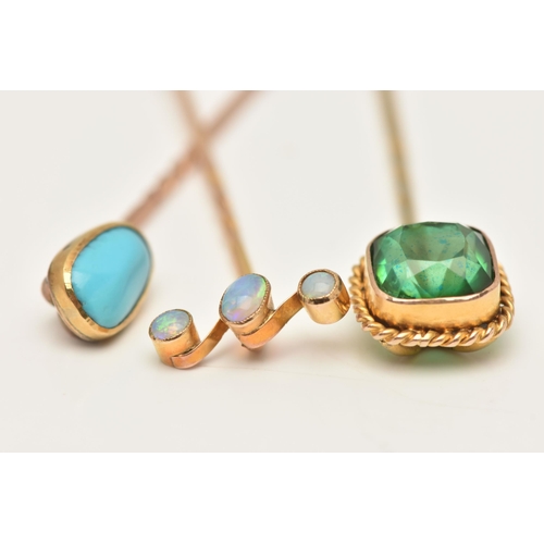 67 - THREE ANTIQUE STICKPINS, to include a three stone opal cabochon stickpin, an oval turquoise cabochon... 