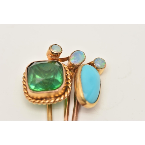 67 - THREE ANTIQUE STICKPINS, to include a three stone opal cabochon stickpin, an oval turquoise cabochon... 