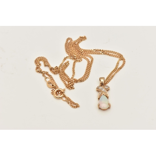 72 - A 9CT GOLD OPAL AND DIAMOND PENDANT AND CHAIN, designed as a pear shape opal cabochon beneath a bril... 