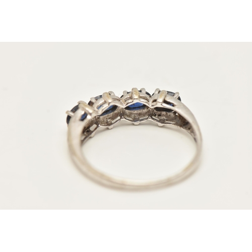 75 - A 9CT WHITE GOLD SAPPHIRE RING, designed as a line of four oval claw set sapphires, 9ct hallmark, ri... 