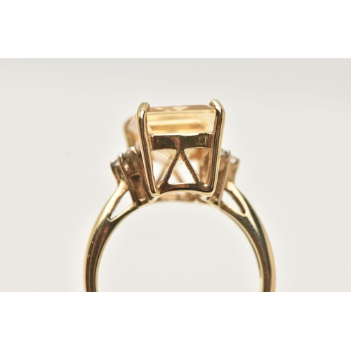 76 - A 9CT GEM RING, designed as a rectangular gem, possibly tourmaline, with colourless gem detail to th... 