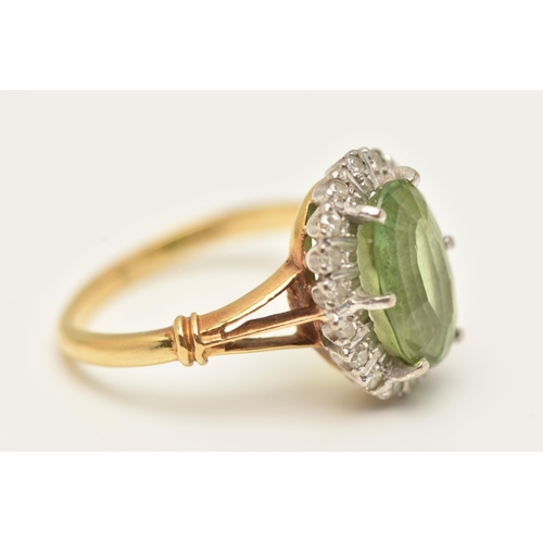 77 - A PERIDOT AND DIAMOND CLUSTER RING, the oval peridot within a single cut diamond surround, to the tr... 